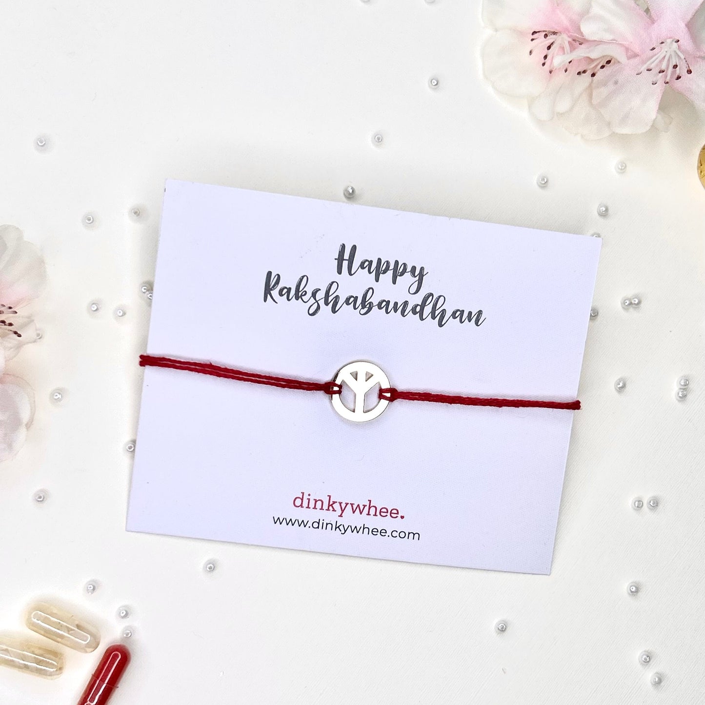 peace gold plated rakhi