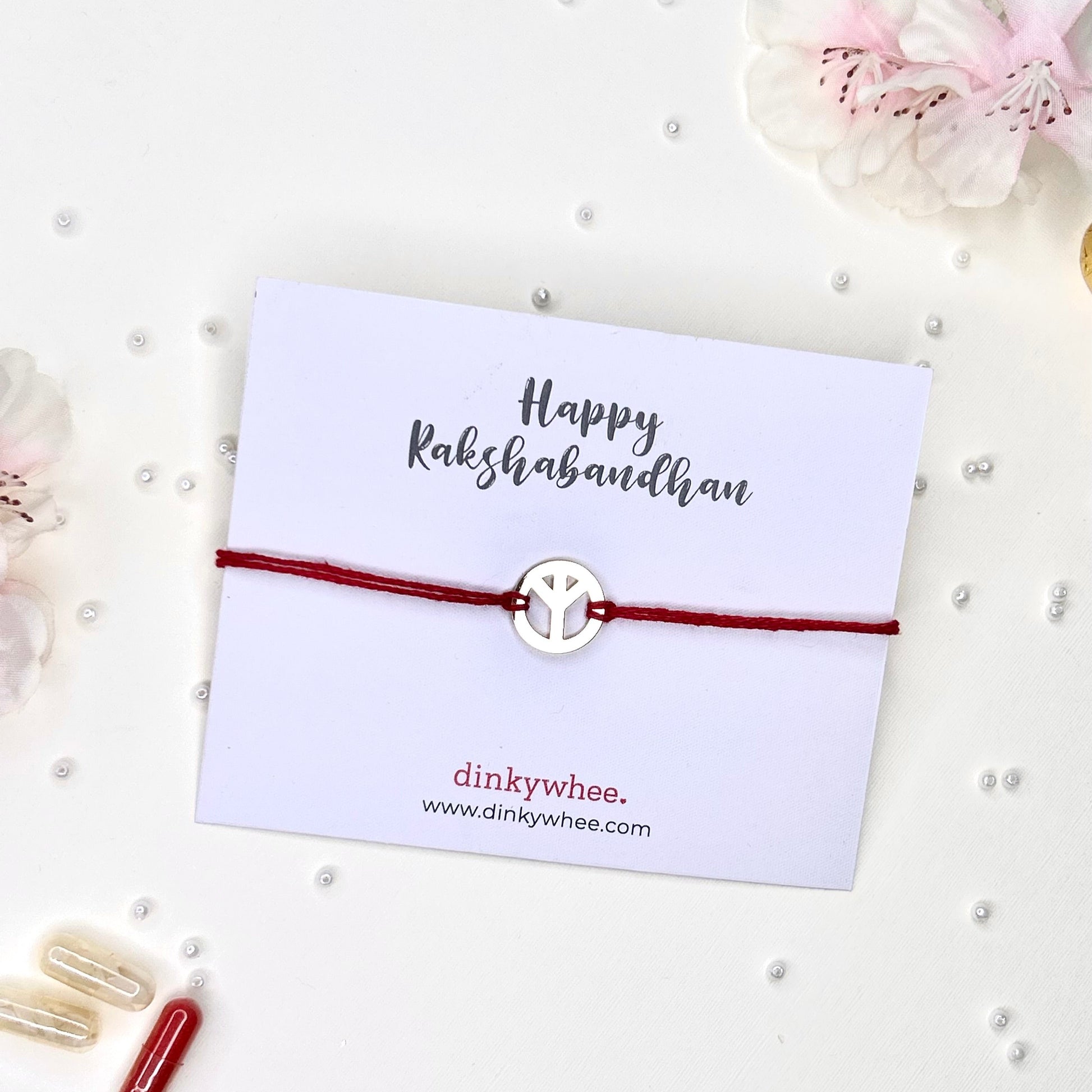 peace gold plated rakhi