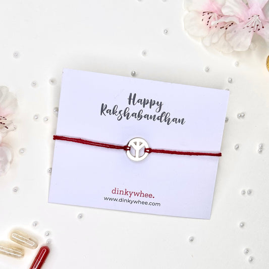 peace gold plated rakhi