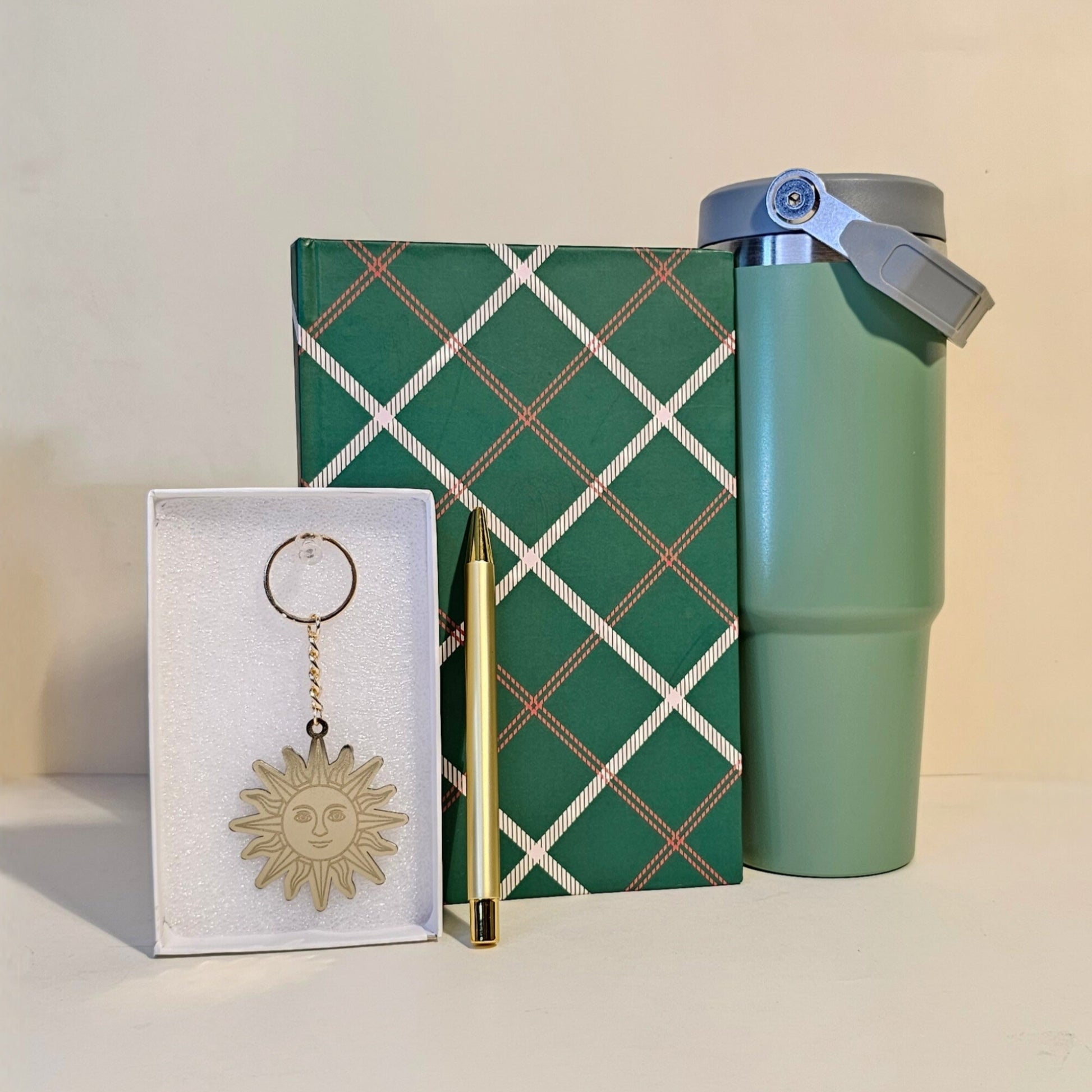 Green tumbler, keychain, and gift box