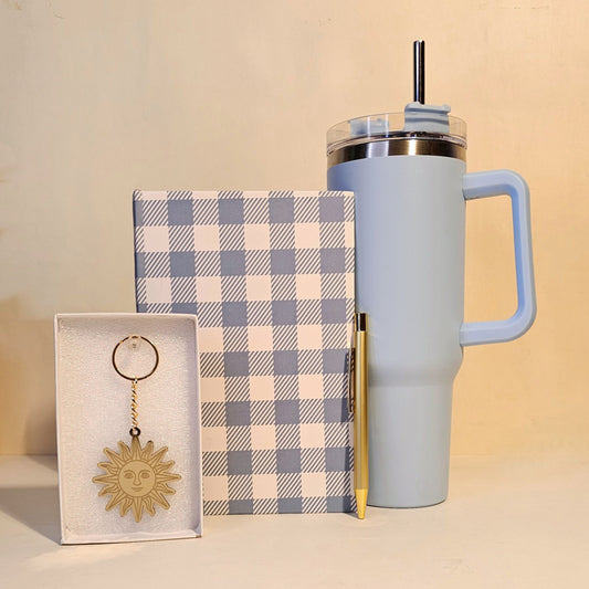Light blue tumbler with a checkered notebook and keychain gift hamper