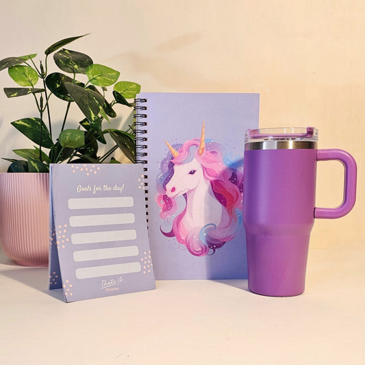 Purple mug with unicorn design, pink notebook, and purple tumbler